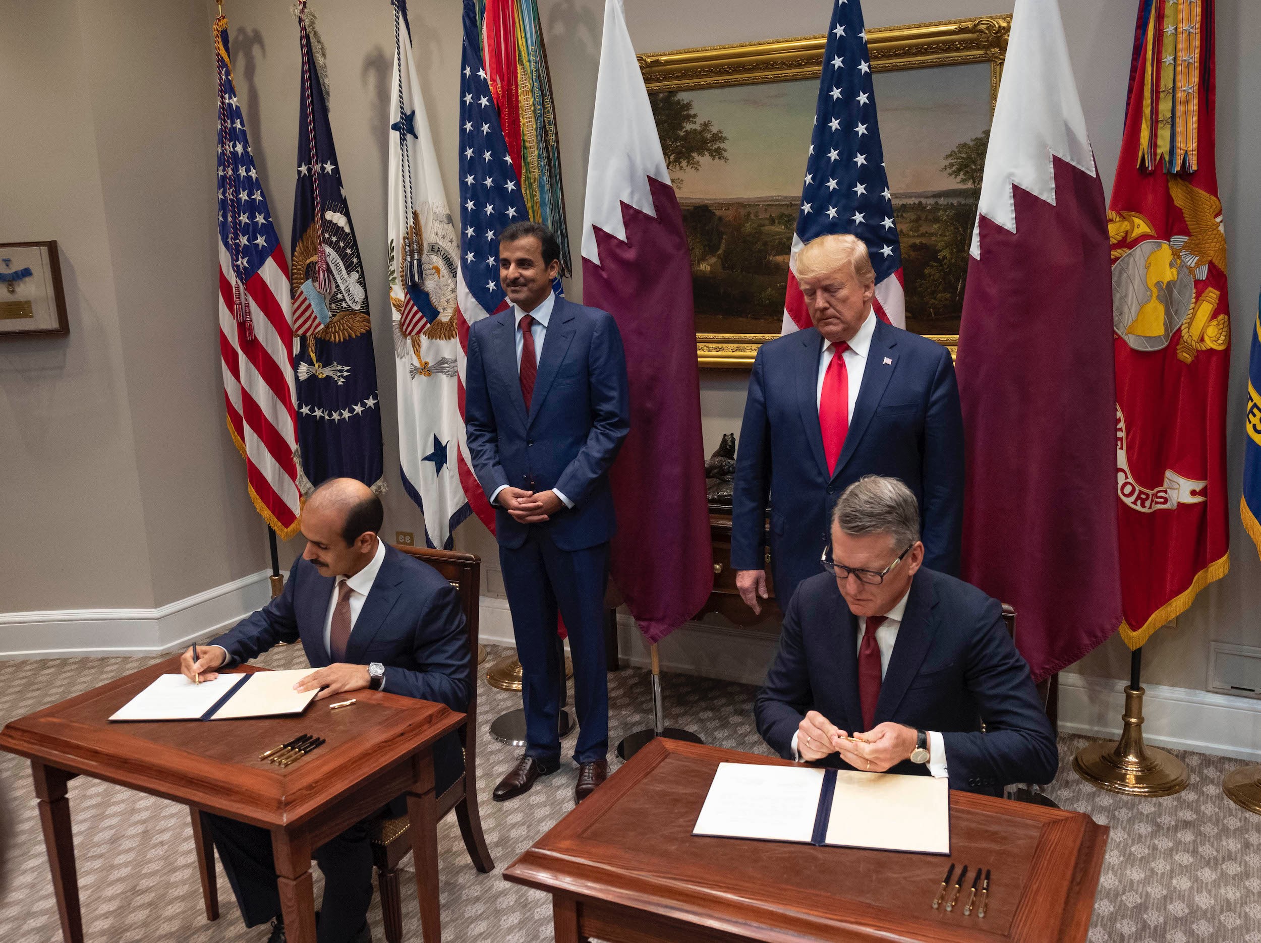 President Donald Trump and His Highness, Sheikh Tamim bin Hamad Al Thani, Amir of the State of Qatar, witness an agreement signed by Chevron Phillips Chemical President and CEO Mark Lashier and His Excellency Mr. Saad Sherida Al-Kaabi, Qatar’s Minister of State.