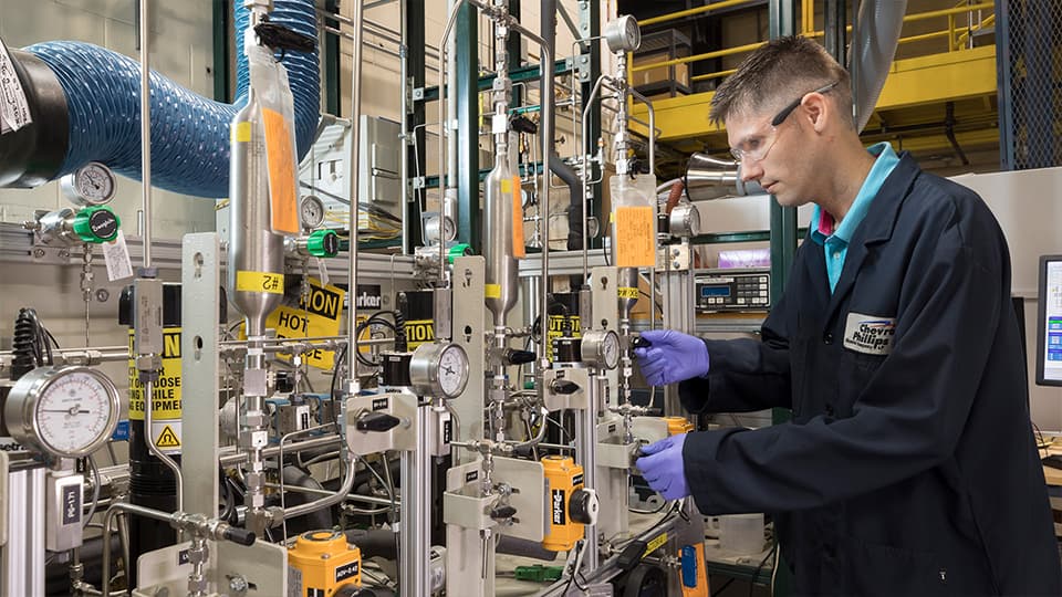 Chevron Phillips Chemical employee operating machinery