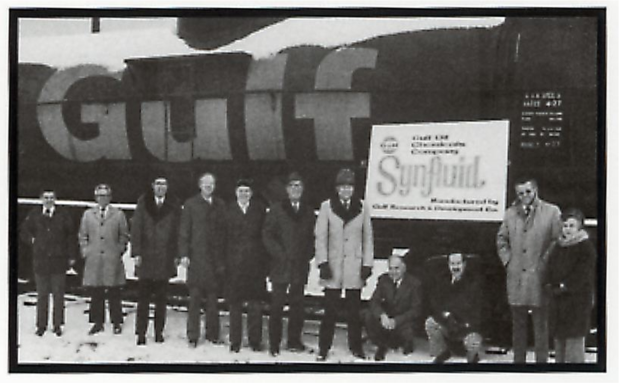 Gulf Oil team with early Synfluid PAO signage