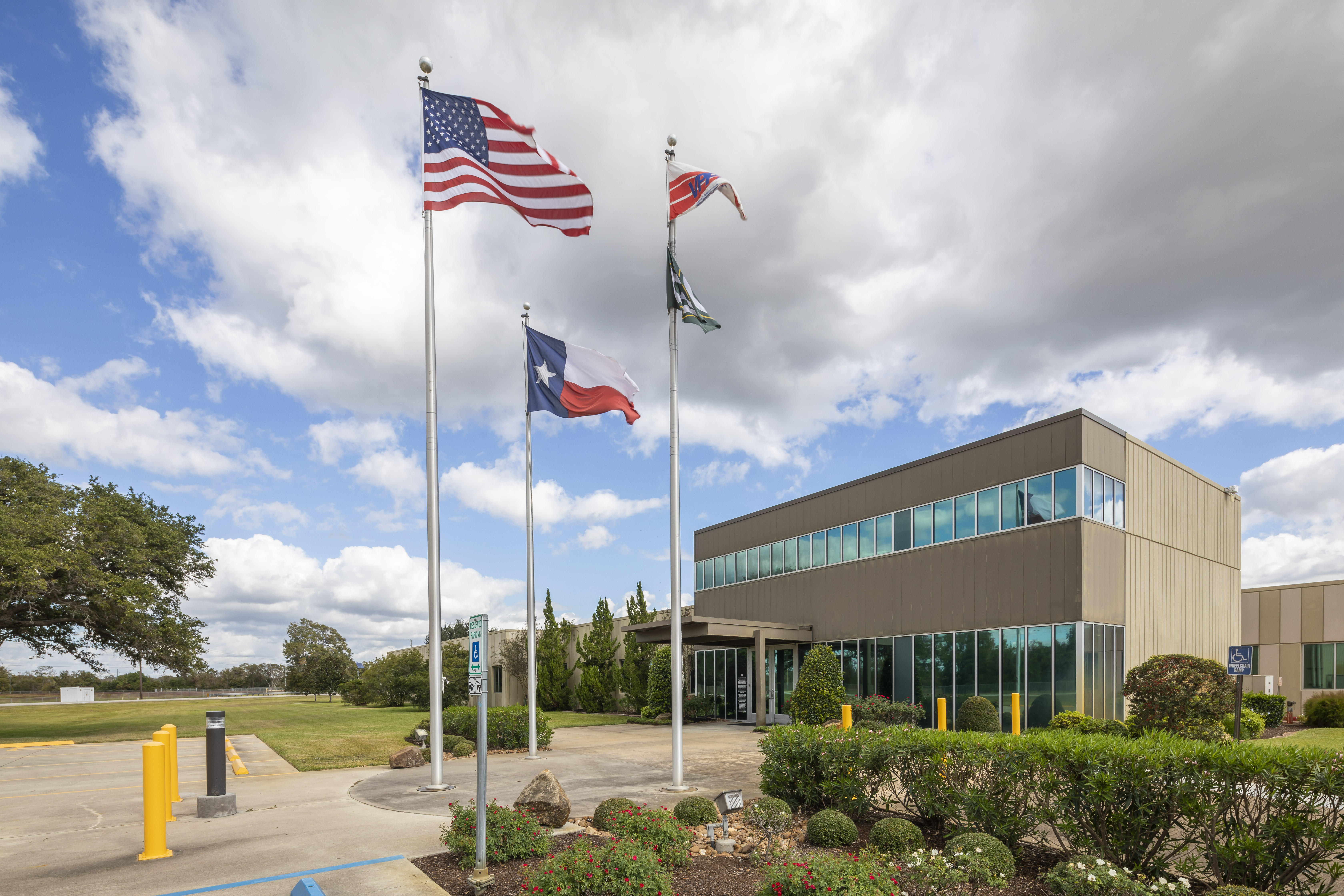 Flags flying in front of building