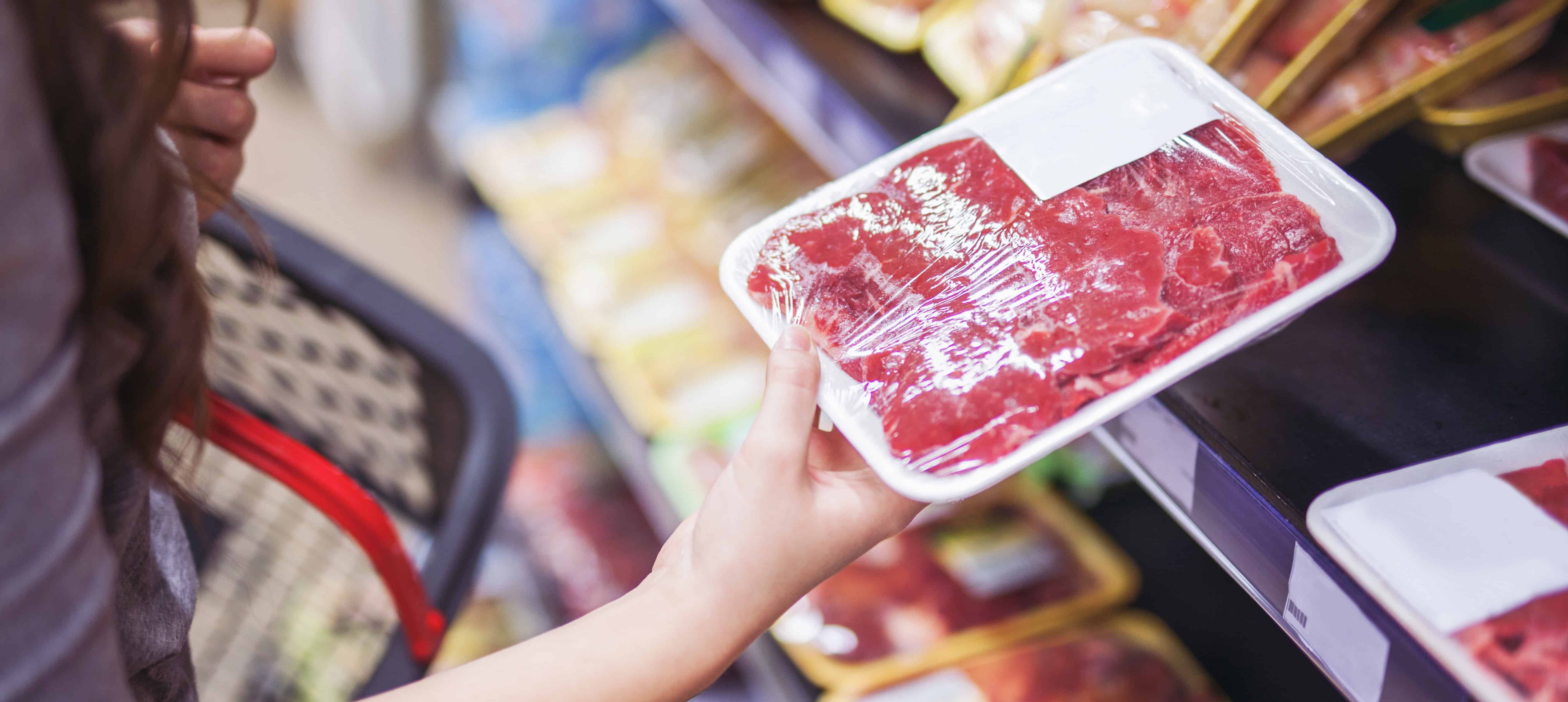 Meat packaged in plastic wrap