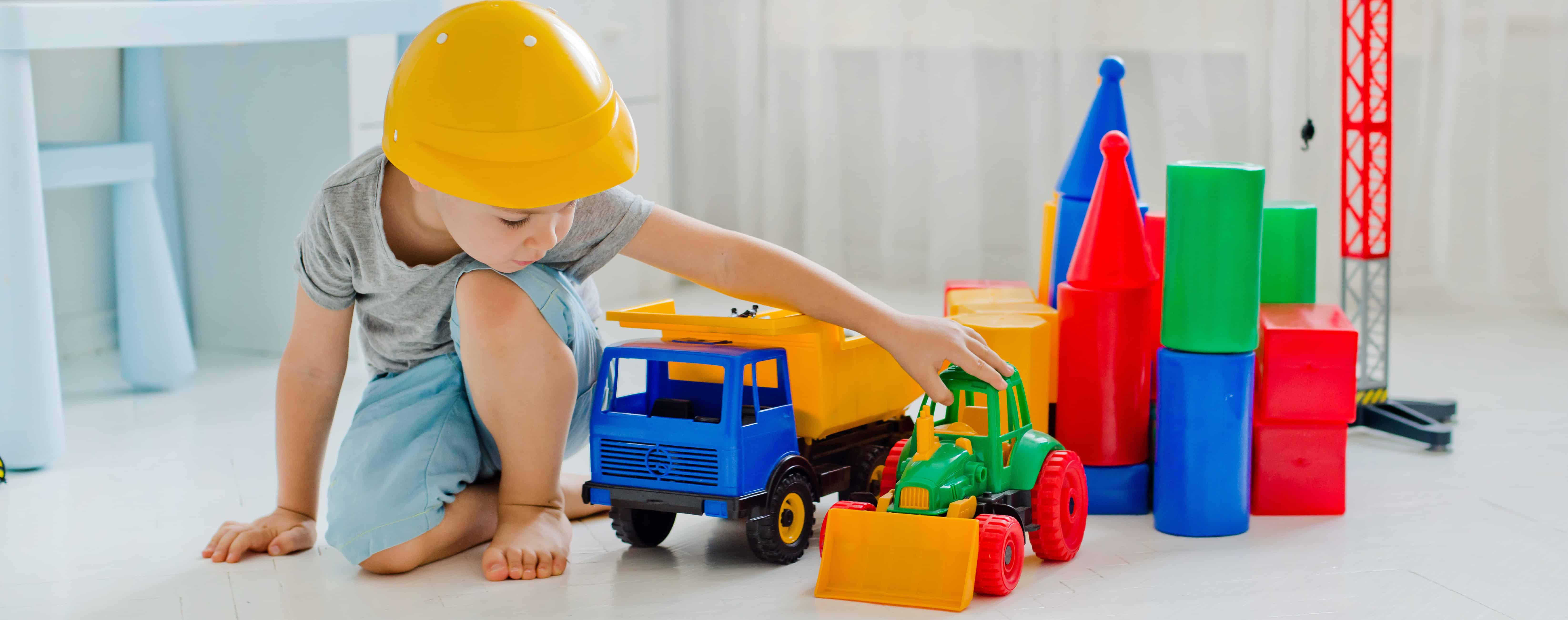 boy plays with toys