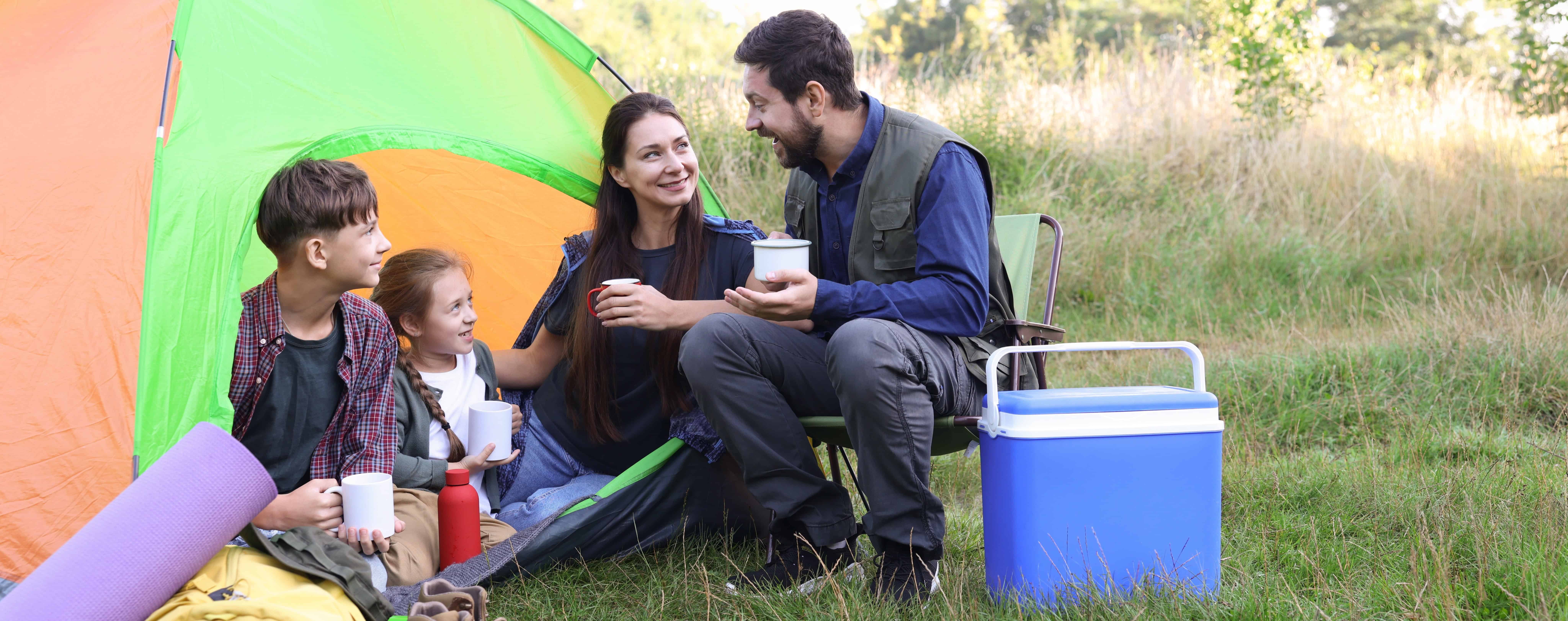 family camps with cooler and tent