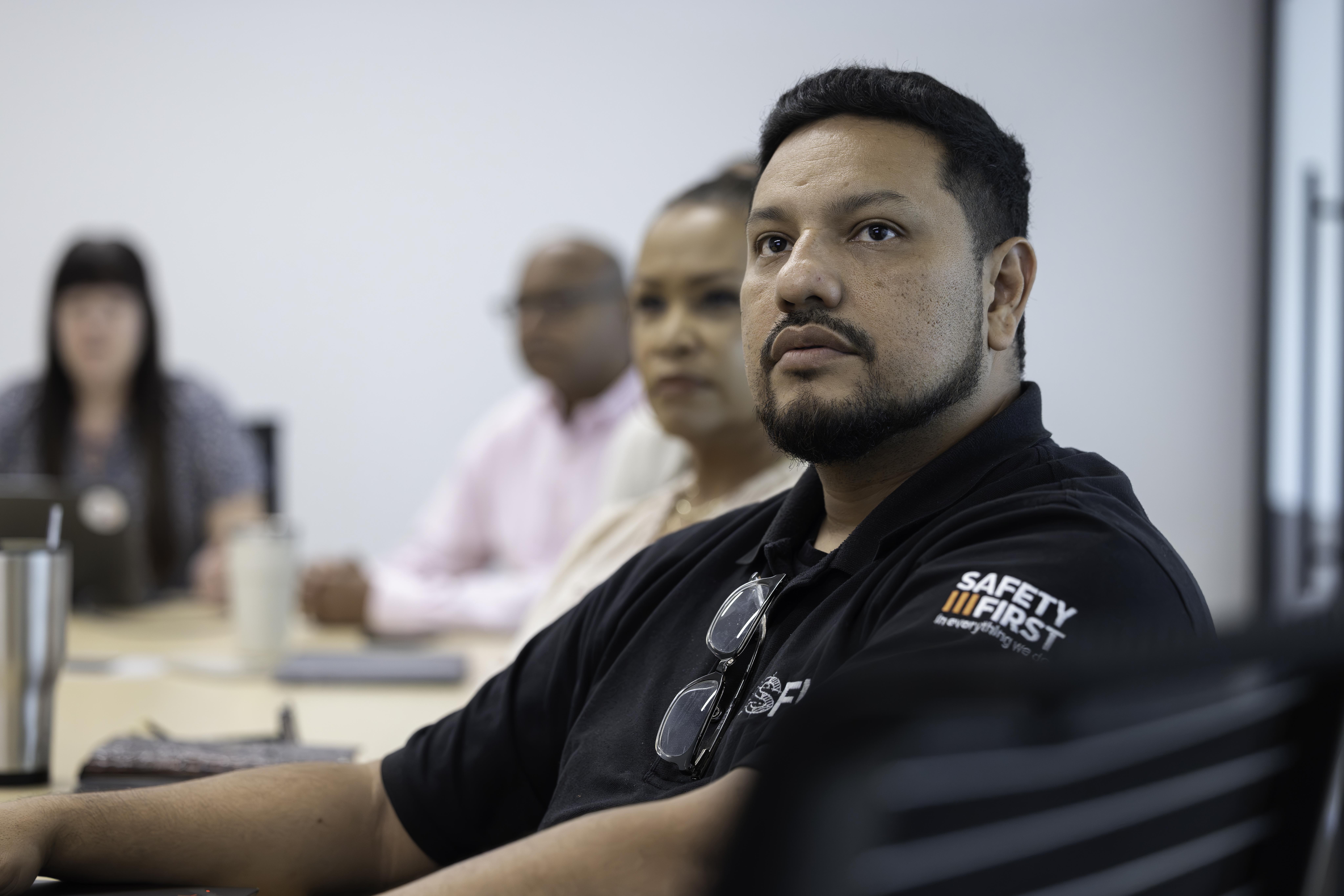 Employees sitting in a meeting room