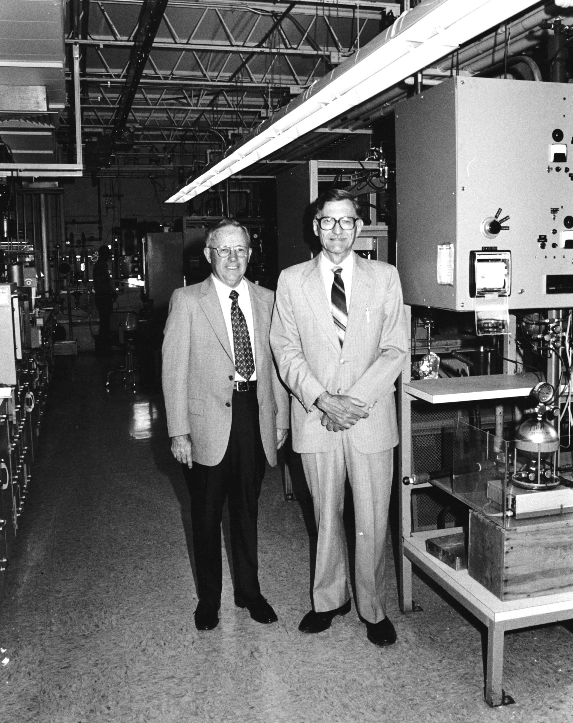 Two males standing in building