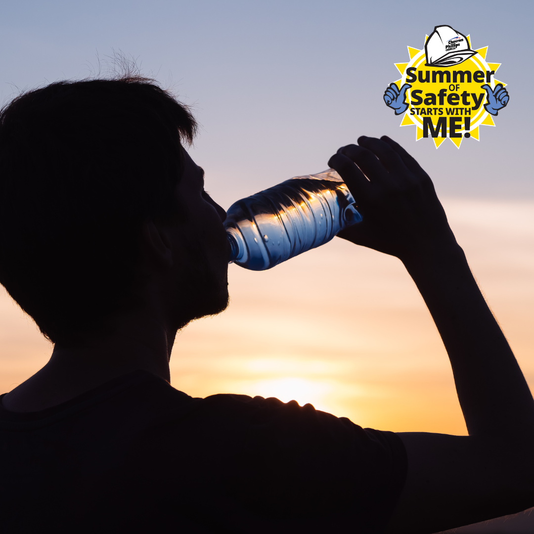 Person drinking from a water bottle