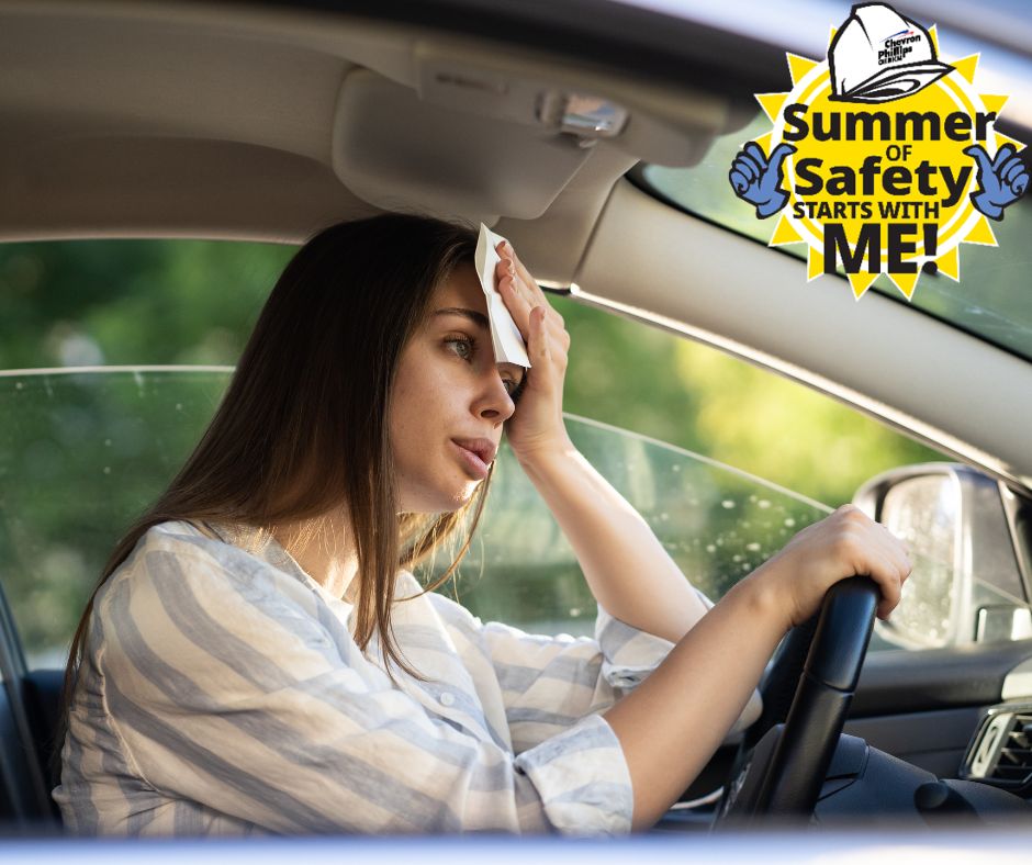 Image of woman in car wiping forehead from heat